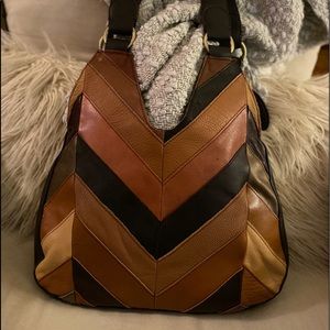 Black rivet, patch, hobo tote.